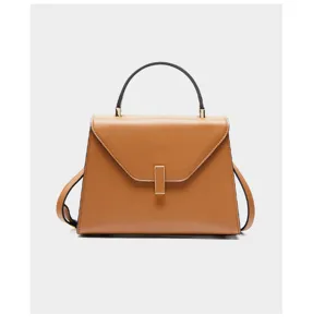 Brown leather structured top-handle handbag detail showcasing metal clasp and flap design.
