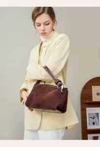 Stylish brown suede women shoulder handbag detail shot, elegant daily casual bag design.