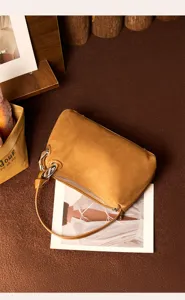 Elegant brown suede shoulder bag for women, stylish autumn winter handbag with metal chain.