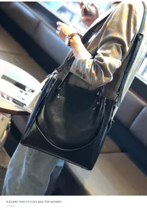 Elegante bolso de hombro de cuero negro para mujer, bolso grande y estiloso para uso diario.