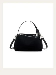Detailed view of black leather women shoulder handbag with metal ring and zipper closure.