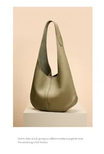 Detail view of genuine leather hobo shoulder bag, versatile large capacity commute tote.