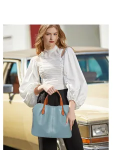 Detail view of a genuine leather women tote handbag, color-block minimalist design for work.