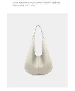 Minimalist leather hobo shoulder bag, premium creamy white commuter bag detail.