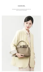 Stylish leather handbag with top handle and elegant lock closure detail for women urban daily wear.