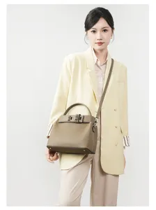Detailed view of the premium leather top-handle crossbody bag, elegant design for commute.