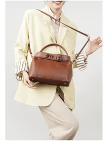 Stylish genuine leather brown top handle shoulder bag for women daily office commute.