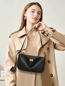 Classic black leather underarm shoulder bag for women, chic commuting handbag and crossbody.
