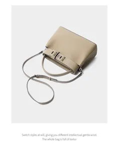 Elegant leather shoulder bag with chic handle and strap, perfect for daily commuting style.