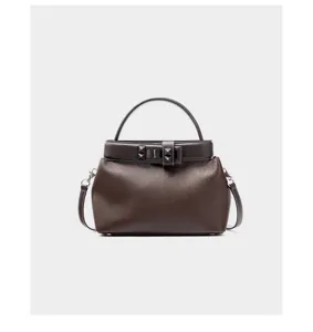 Brown leather top handle crossbody bag with stylish metal stud and buckle details.