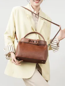 Genuine leather top handle shoulder bag for women, stylish brown crossbody commuter handbag.
