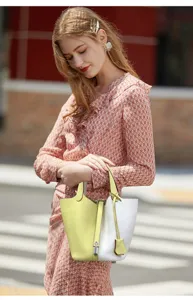 Premium genuine leather bucket handbag for women, stylish two-tone daily tote shoulder bag.