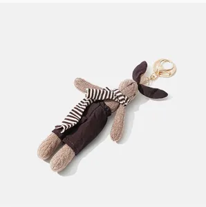 Mignon porte-clés en peluche lapin tricoté avec écharpe rayée, mini pendentif de sac lapin.