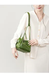 Green genuine leather woven shoulder bag for women, large capacity stylish daily handbag.