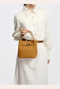 Elegant genuine leather bucket handbag with classic turn-lock closure for women daily commute.