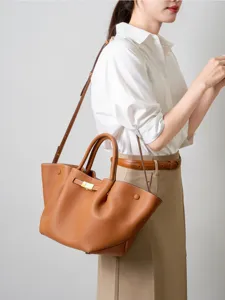 Brown leather commute shoulder tote bag with metal lock, spacious design for women.
