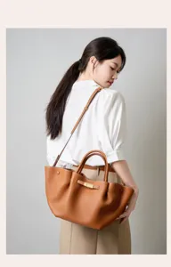 Leather commuting shoulder bag detail, large capacity brown handbag for women work chic.
