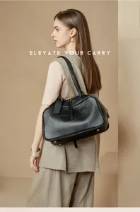 Classic black leather Boston handbag for women, large capacity shoulder bag for daily commute.