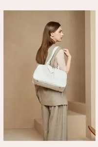 White leather Boston shoulder bag for women, ideal for daily commute and stylish look.