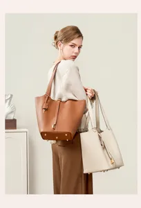 Premium top-layer cowhide leather bucket bag, stylish commuter shoulder bag for women.