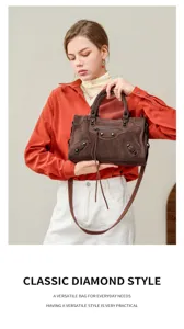 Suede motorcycle shoulder bag for women, classic studded design with top handle.