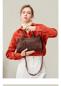 Stylish women suede motorcycle handbag, casual shoulder tote bag with vintage design details.