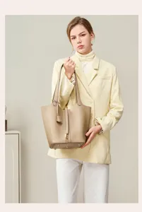 Genuine leather bucket bag for women, stylish large capacity shoulder tote, premium commuter bag.