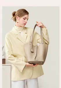 Detailed view of the premium genuine leather bucket bag, elegant shoulder commuting bag style.