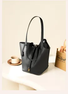Black leather bucket bag for women, classic shoulder handbag, large capacity commuting tote bag.