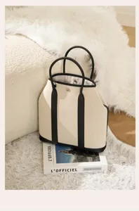Vertical canvas garden tote bag with leather handles, large capacity stylish shoulder handbag.