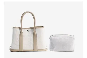 Stylish canvas tote bag with leather trim and matching pouch for women daily commuting.