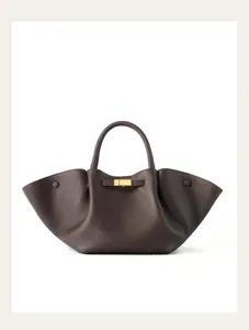 Brown genuine leather tote bag with winged gussets, top handle and metal clasp closure.