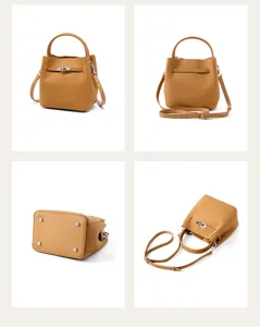 Genuine leather bucket bag with top handle and adjustable strap for women stylish daily use.