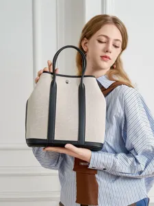 Canvas leather tote bag, stylish large capacity shoulder handbag for women daily use.
