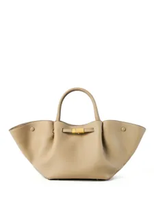 Elegant leather tote handbag with structured winged design and gold-tone clasp for women.