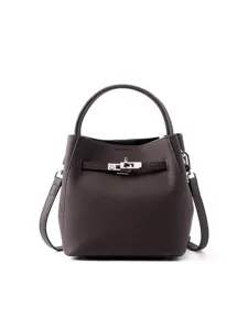 Dark brown leather bucket bag with metal turn-lock and shoulder strap for women daily use.