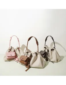 Chic niche canvas bucket shoulder bag, casual minimalist crossbody cloud handbag.