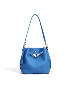 Blue leather bucket bag detailed view, stylish solid color single shoulder crossbody handbag.