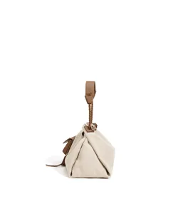 Close-up detail of canvas handbag with brown leather braided handle and stylish fold design.