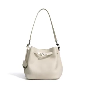 Litchi grain cowhide bucket bag, elegant casual commute shoulder bag with metal lock design.