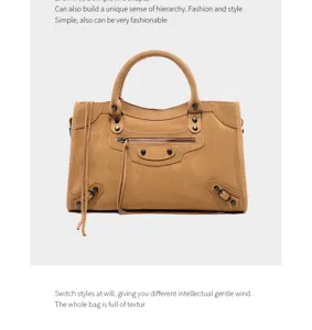 Stylish suede motorcycle handbag for women, chic shoulder bag with classic rivet details.