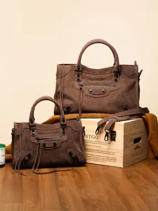 Classic suede motorcycle handbag set for women, stylish brown shoulder bag with shoulder strap.