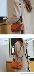 Vintage brown leather shoulder bag with ethnic strap detail, stylish cross-body bag for daily wear.