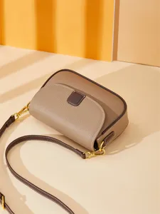 Genuine leather small crossbody bag for women, stylish minimalist shoulder bag with flap design.