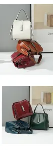 Detail shot of minimalist leather handbag featuring metal clasp and zipper design.