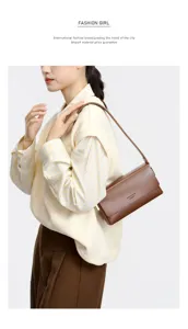 Minimalist brown leather shoulder bag for women, stylish underarm baguette bag for commuting.