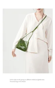 Green woven leather shoulder bag for women, stylish crossbody bag with delicate strap design.