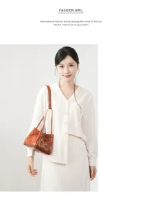 Details of brown leather woven handbag, featuring fine craftsmanship and large capacity.