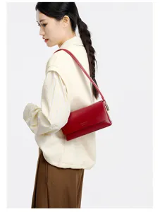 Detailed view of the red leather shoulder bag, minimalist design, underarm style for women.