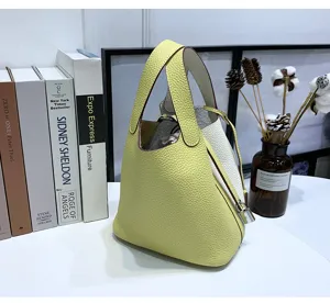 Genuine leather bucket handbag for women, stylish contrast color top-handle tote bag.
